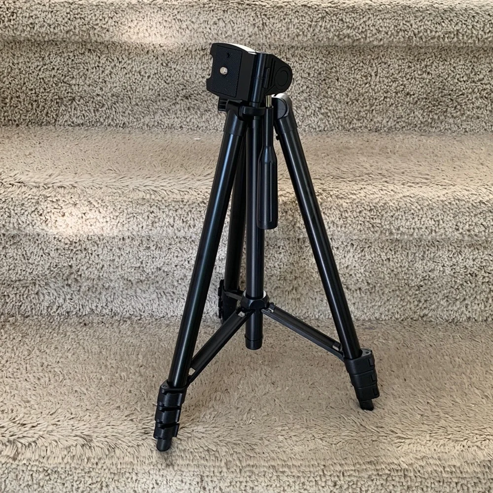 Tripod stand only. Black, adjustable.